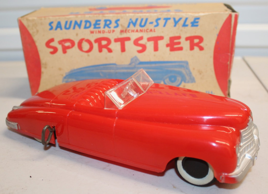 Red Wind Up Saunders NU-Style Spottier with wide white sidewalls and clear windshield